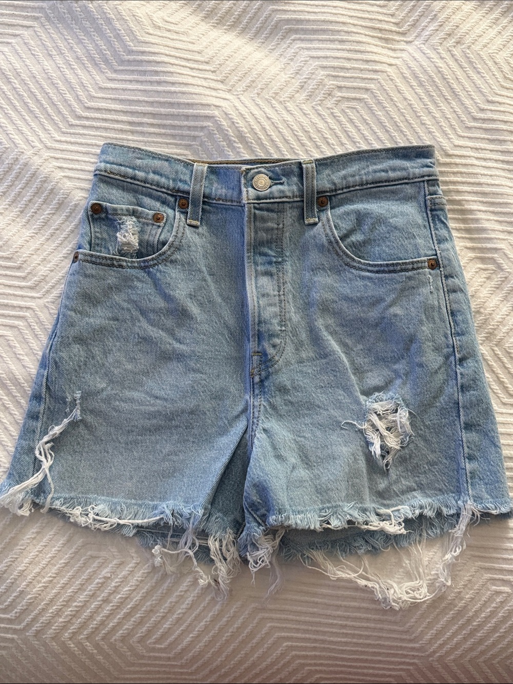 Levi’s Ribcage Light Blue Distressed Denim Shorts